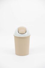 Large Trash Can with Swivel Lid in beige plastic, featuring a tall cylindrical body and dome‑shaped swing top