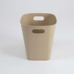 Rectangular waste bin in beige plastic with subtle floral embossing and built‑in side carry handles